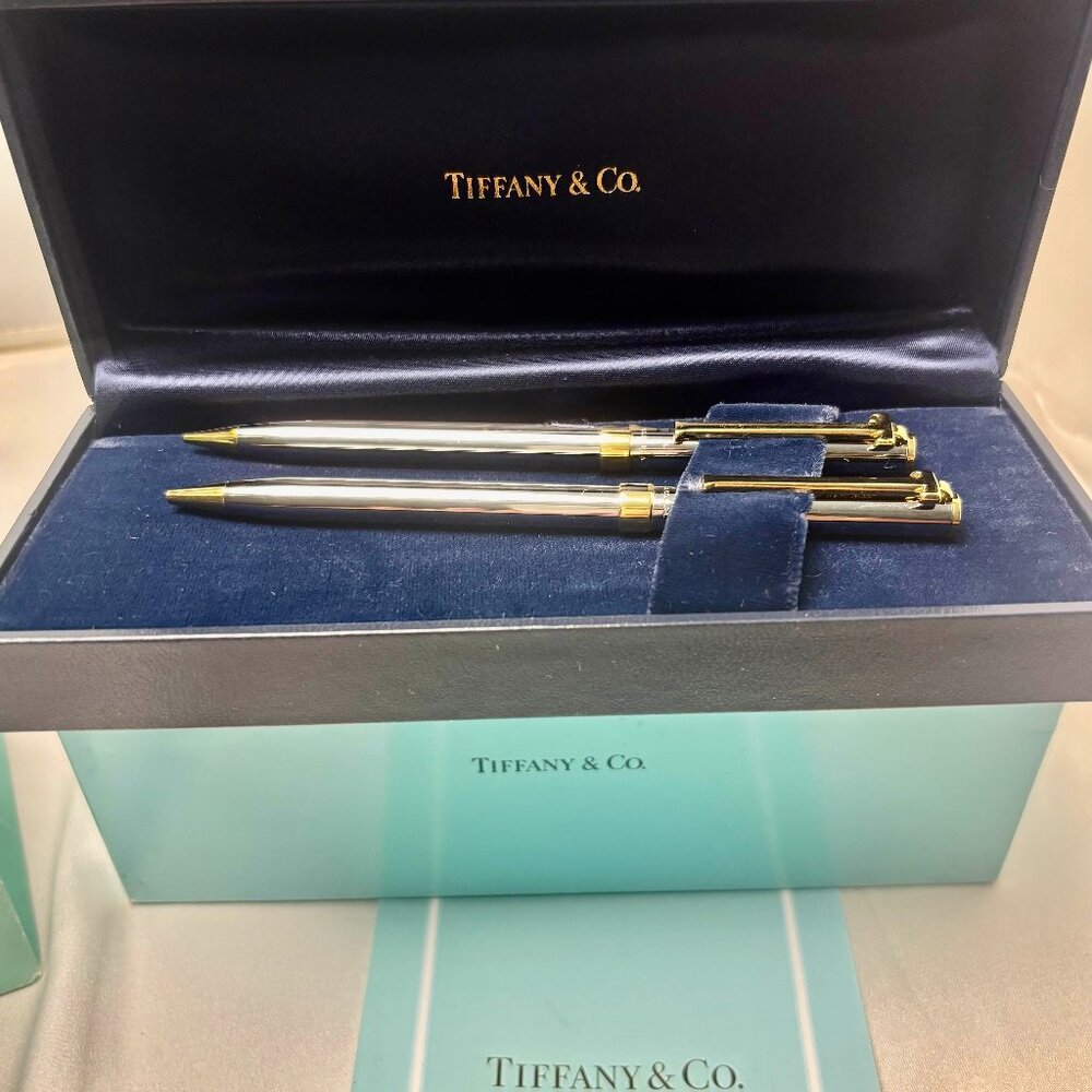 Tiffany & Co. T clip Gold plated and steel mechanical pen and pencil set.